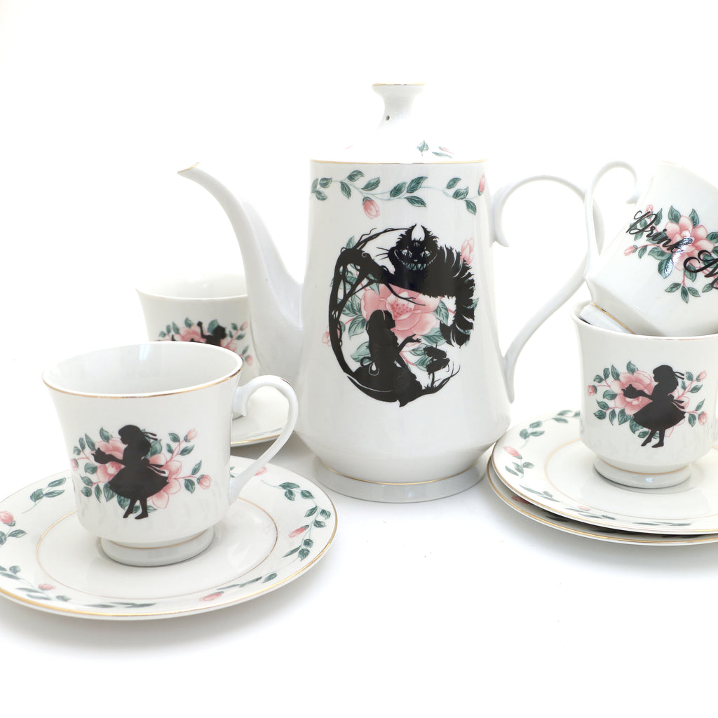 Alice in Wonderland tea set, teapot and four teacup and saucers, vintage upcycled