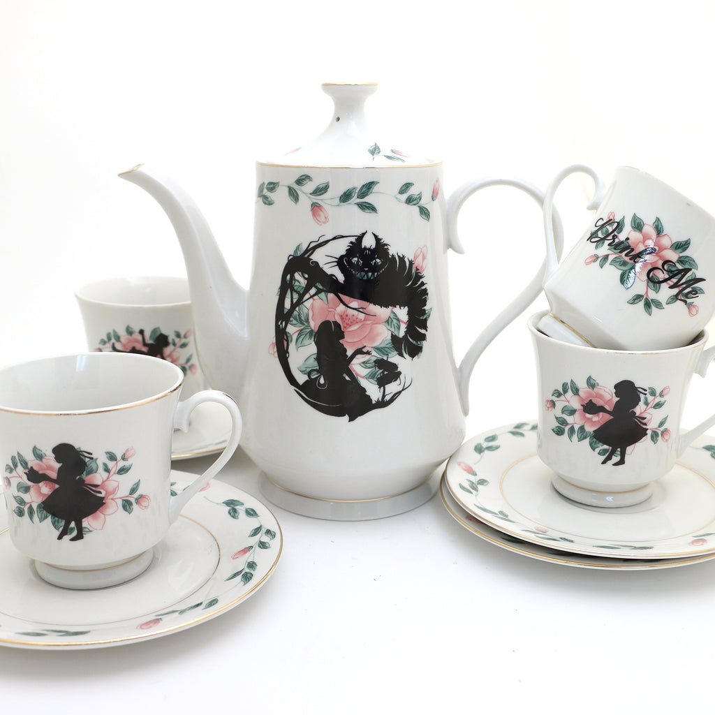 Alice in Wonderland tea set, teapot and four teacup and saucers, vintage upcycled