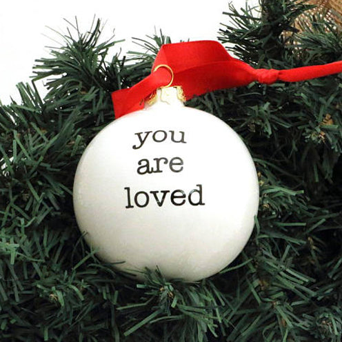 
Handmade ceramic Christmas ornament reads You Are Loved.Say what's in your heart this Holiday with